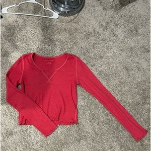 Red thermal v-neck cropped long sleeve shirt.